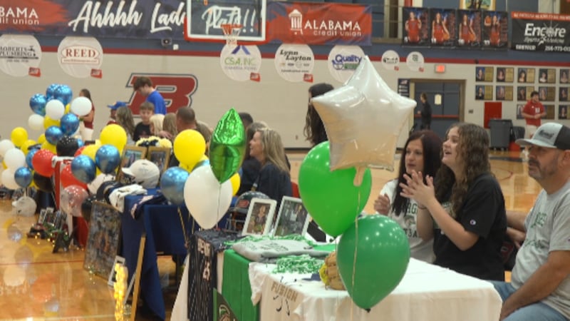 Four Brewer softball players sign their letters of intent on Friday.