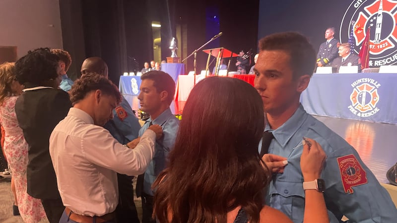 Huntsville Fire & Rescue celebrates graduation of 60th class, pins badges on 18 new firefighters