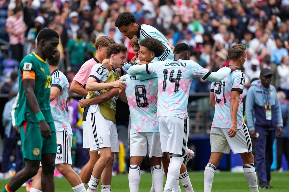 Belgium players celebrate a win during the World Cup round of 32 soccer match between Belgium...