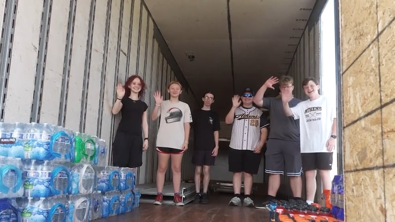 An Athens City Schools marching band kicked off its season with a community water collection...