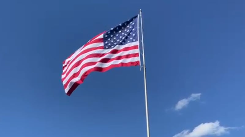 American flag flying high in the sky.