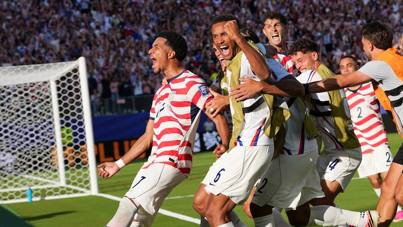 United States' Malik Tillman (17) celebrates with teammates after scoring on a free kick...