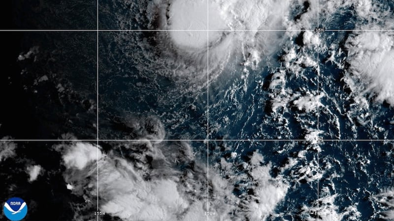 This NOAA satellite image taken Saturday, Aug. 22, 2026, shows Tropical Storm Moke advancing...