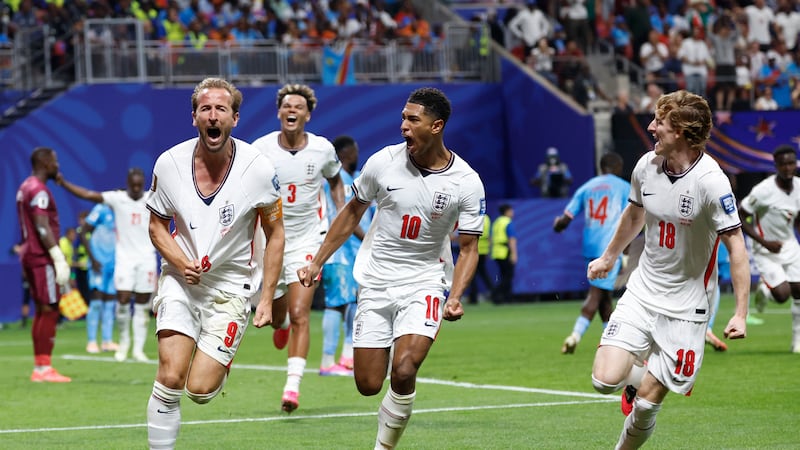 England's Harry Kane (9) celebrates after scoring his side's first goal next to his teammate...